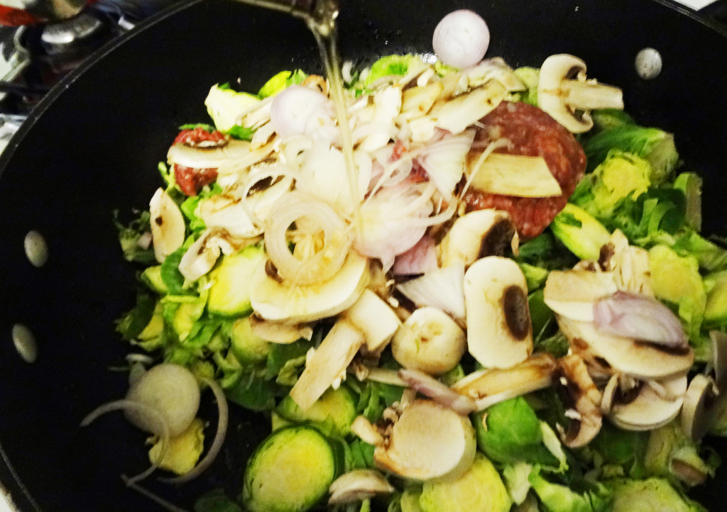 Cooking the brussel sprouts, shallots, mushrooms, and beef
