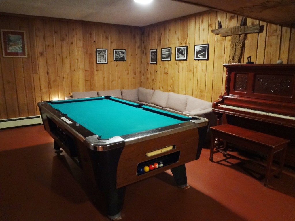 The slighly dilapidated basement pool table