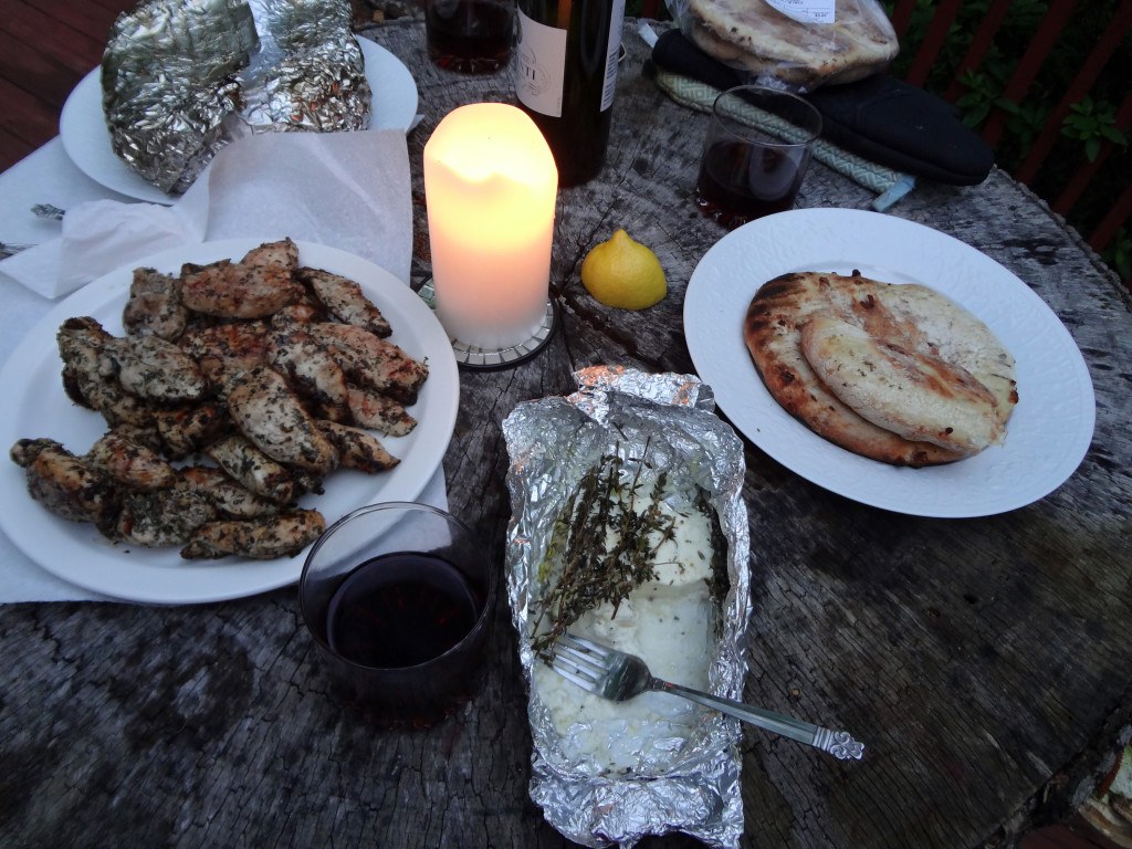 Candlelit meal on a tree stump table