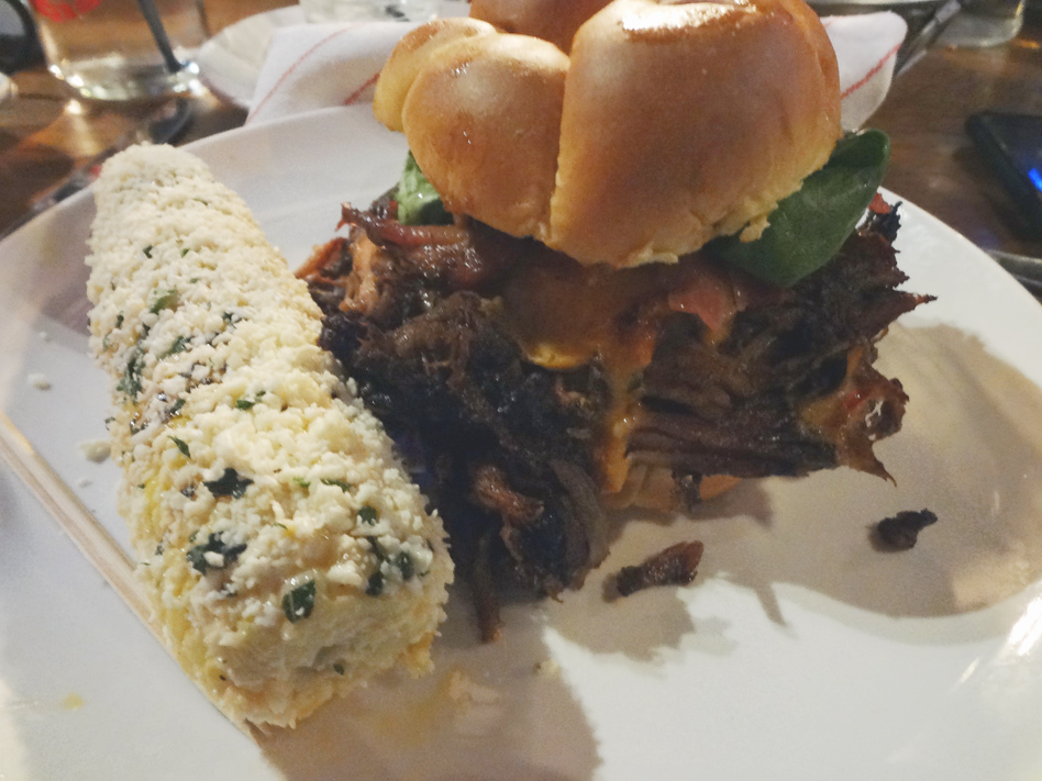 Smoke Ring Show Stopper pork sandwich with chipotle corn on the cob