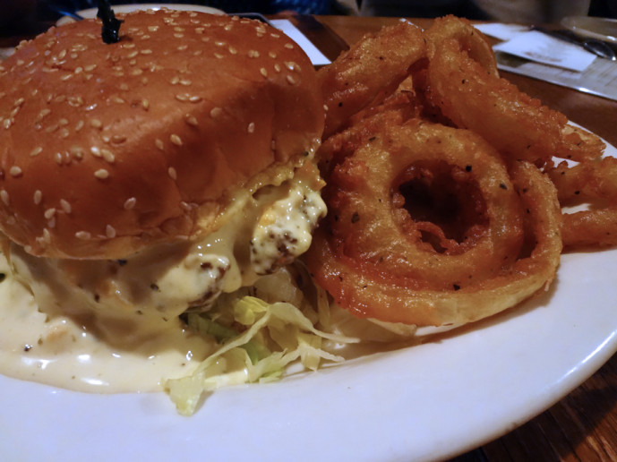House caesar salad burger with onion rings