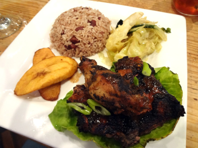 Jerk chicken lunch plate with chopsuey, rice and peas, and plantains.