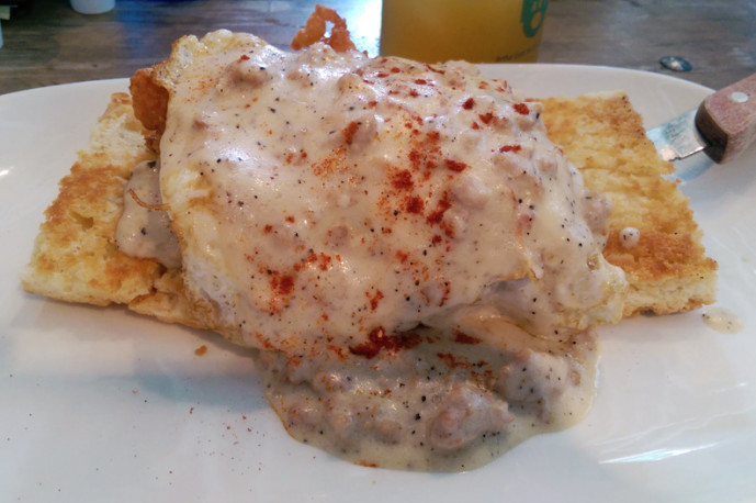 Folk Southern Fried - fried chicken and biscuits with fried eggs and sausage gravy